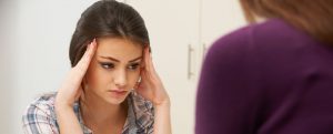 Teenage girl visiting counsellor